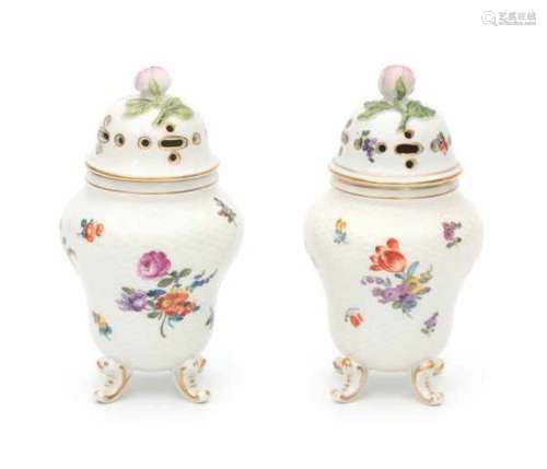 A near pair of German potpourri jars, both decorated with a variety of flowers. Marked for Thüringen