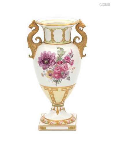 A porcelain baluster vase, decorated with flower bouquets and highlighted in gold. With gilt griffin