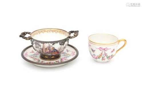 Two silver mounted cup and saucers, one decorated with guirlandes, the other with a romantic