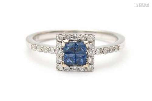 18 carat white gold ring, set with four blue square cut sapphires, surrounded by brilliant cut