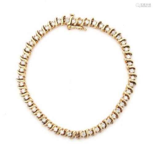 A yellow gold tennis bracelet with S-shaped links. Set with brilliant cut diamonds, total ca. 1.95