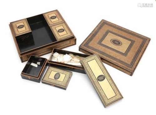 A French laquered games box, the interior with five small boxes. 19th century.8 x 29 x 25 cm.- - -