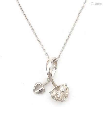 A 18 carat white gold leave shaped pendant with heart on a fine chain necklace. Set with a heart