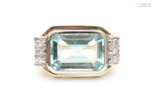 14 carat yellow gold ring with a blue synthetic stone and 6 brilliant cut diamonds set in white