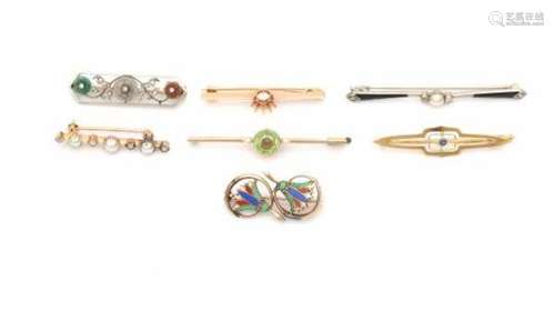 Collection of seven gold brooches, all 14 carat gold and adorned with peridot, quartz, enamel and