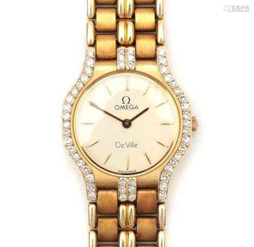 14 carat gold ladies watch Omega de Ville with diamond. Set with eight cut Diamonds, ca. 0.50 ct. in