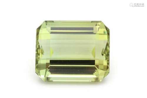 Yellow green beryl of 41.9 ct., emerald cut. Never been set, in original parcel paper. Provenance: