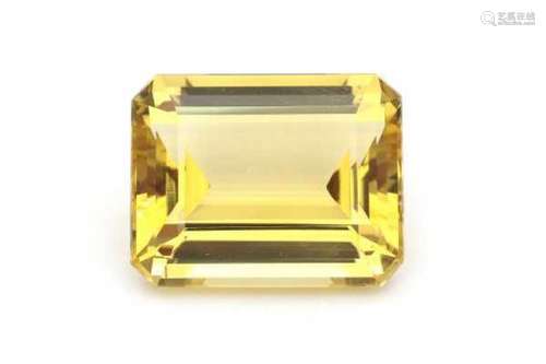 Heliodore, yellow beryl of 32.31 carat, emerald cut. Never been set, in original parcel paper.