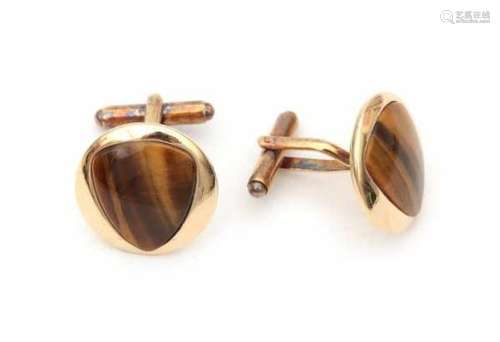 14 carat yellow gold pair of cuff links with tiger eye, round model with inlay of tiger eye. Gross