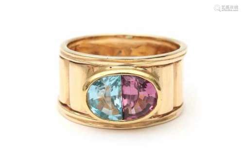 14 carat yellow gold ring with topaz and tourmaline, a wide yelow gold band set with two moonshape