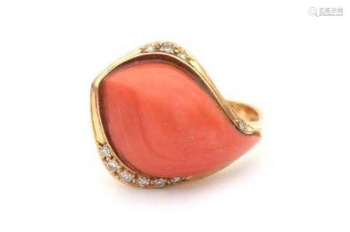 18 carat yellow gold ring with coral and diamond. A cabochon cut precious coral adorned with ten