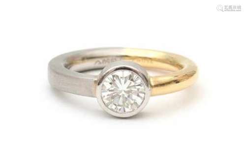 Platinum and gold diamond solitaire ring, with gemmologicqal report. Contemporary solitaire ring set