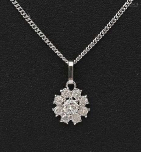 14 carat white gold necklace with diamond pendant. Pendant in a cluster design with a slightly