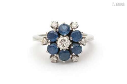 14 carat white gold diamond and sapphire cluster ring, set with seven brilliant cut diamonds total