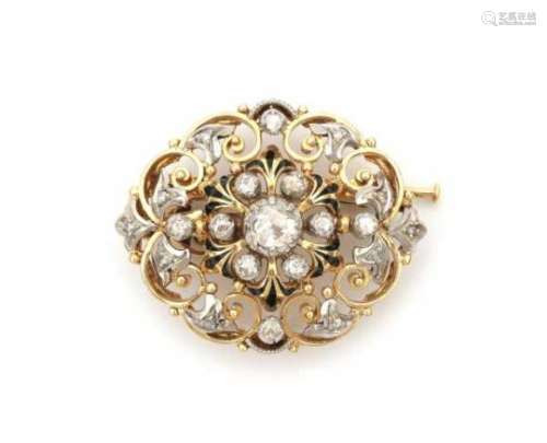 18 carat gold with silver pendant/ brooch set with rose cut diamonds. Floral design and black enamel