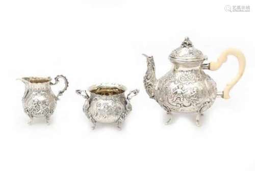 A German three piece silver tea service. Maker's mark Weinranck & Schmidt, Hanau Ca. 1900. Teapot