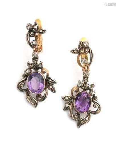 19 carat gold and silver earrings with amethyst. Long design set with an oval cut Amethyst in silver