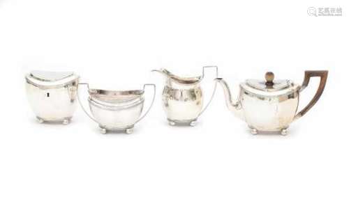 A Dutch four-piece Sterling silver tea service. The teacaddy without the key. Maker's mark Jacobus