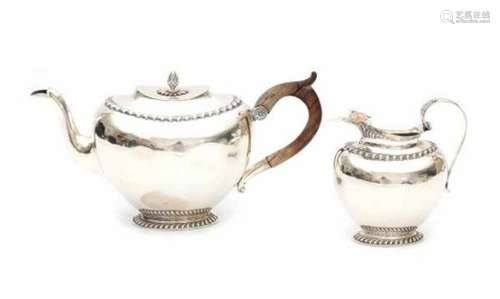 A Dutch Sterling silver teapot and milkjug. Maker's mark Jacques Vos & Co., Haarlem. Year letter