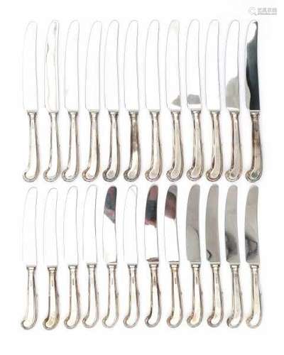 Twelve large and twelve small knives with silver pistol handles. Hallmarks Sheffield. Maker's