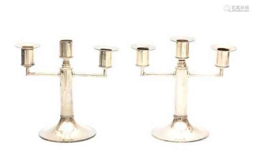 A pair of silver candelabra. One bobeche is missing.height 20 cm.- - -29.00 % buyer's premium on the