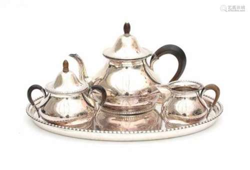 A three piece foreign silver tea set. With an oval silver tray. Imported by Begeer, v. Kempen &