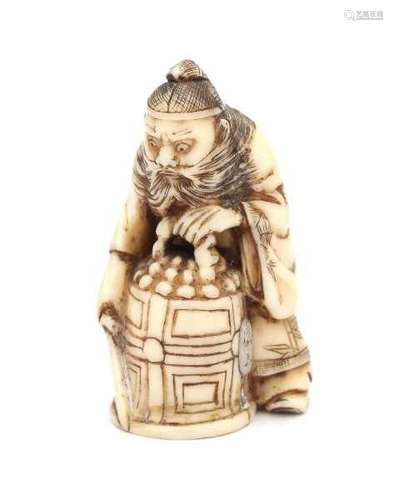 A Japanese ivory netsuke, Shoki capturing an oni under a bell. Signed Yozen. Meiji period (1868-