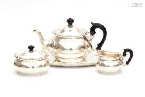 A foreign silver three-piece silver tea service on tray. Imported by Begeer, v. Kempen & Vos. With