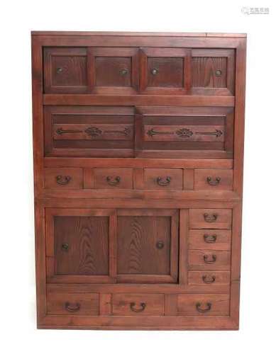 A Japanese two-part zelkova cabinet 'Heya-Dansu'. The front with drawers and sliding doors. The