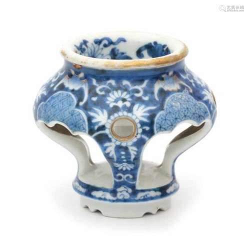 A Chinese blue and white salt cellar, decorated with flowers and bats. The bats and rim