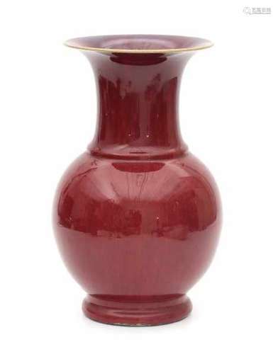 A Chinese monochrome copper red vase, the inside of the neck with flambé glaze. 19th century.