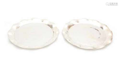 A pair of Mexican Sterling silver trays. Maker's mark Casa Prieto, Juarez.Diameter 39.5 cm.