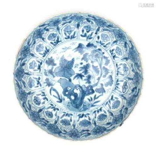 A Chinese blue and white plate, decorated with flowering lotus and peonies. With artemesia leaf