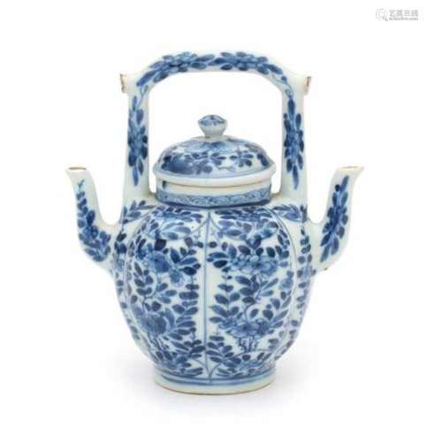 A Chinese blue and white double-spouted ewer, decorated with panels of flowers. Kangxi period (