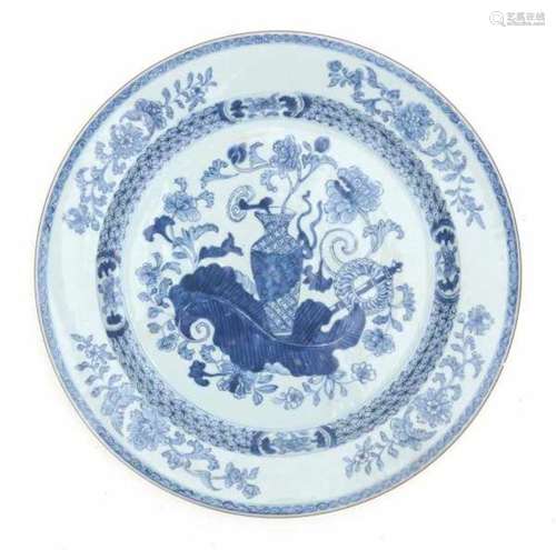 A Chinese blue and white charger, decorated with a vase and various flowers. 18th centuryDiameter 38