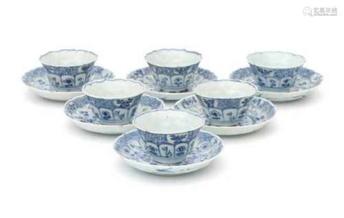 A set of six Chinese blue and white cup and saucers, decorated with flowers. Kangxi (1662-1722)