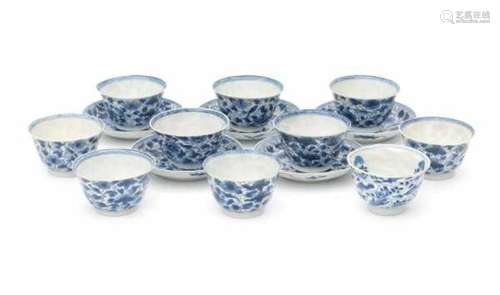 A set of ten Chinese cups and five saucers, decorated with a pattern of birds and flowers. With