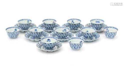 A set of eight blue and white cup and saucers, decorated with flowers. With three extra cups. With