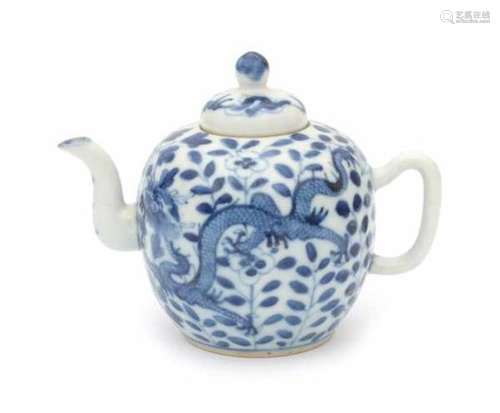 A Chinese blue and white teapot, decorated with two dragons amidst flowers. Marked with a four