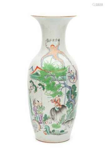 A Chinese famille rose vase, decorated with playing boys and scholars in a garden. Early 20th