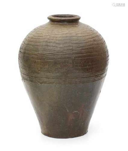 A brown glazed Chinese provincial water jar, with incised pattern. Stamped with a two character