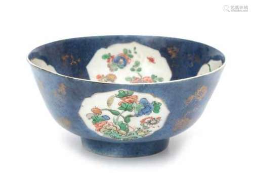 A Chinese powder blue bowl, decorated on the inside and outside with panels of flowers. With lozenge