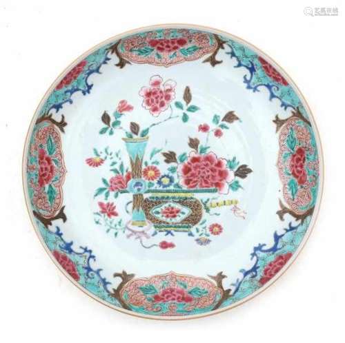 A Chinese famille rose dish, decorated with flowers. The outside with flowers on a lightbrown