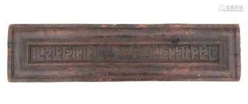 A Tibetan carved wooden book cover, with characters, a prancing horse. 19th century65 x 16 cm.- - -