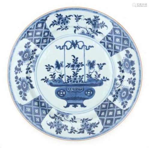 A Chinese blue and white charger, decorated with a flower basket. Qianlong period (1735-1796).