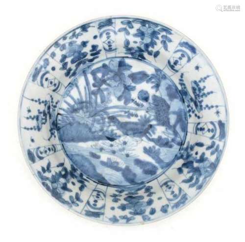 A Chinese blue and white dish, decorated with a bird amidst lotus flowers. Wanli period (1572-