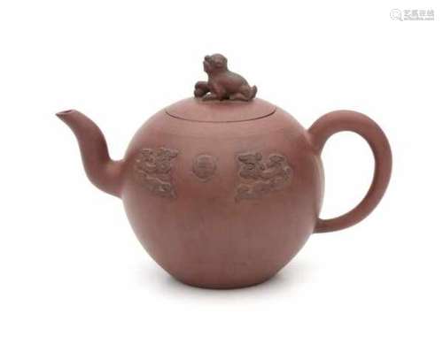 A large Yixing teapot decorated with appliques of dragons with flaming pearl on both sides. Marked