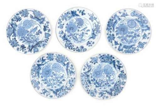 A set of five Chinese blue and white plates, decorated with birds between flowering peonies. With