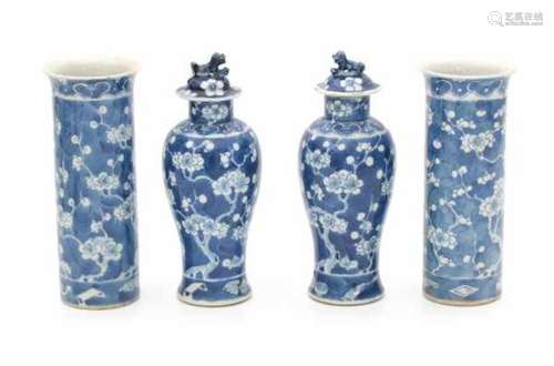 A four piece Chinese blue and white garniture, decorated with cherry blossom. With apocryphal Kangxi