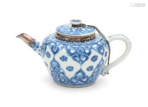 A Chinese blue and white teapot, with later silver mounts. Kangxi period (1662-1722).height 9 cm.- -